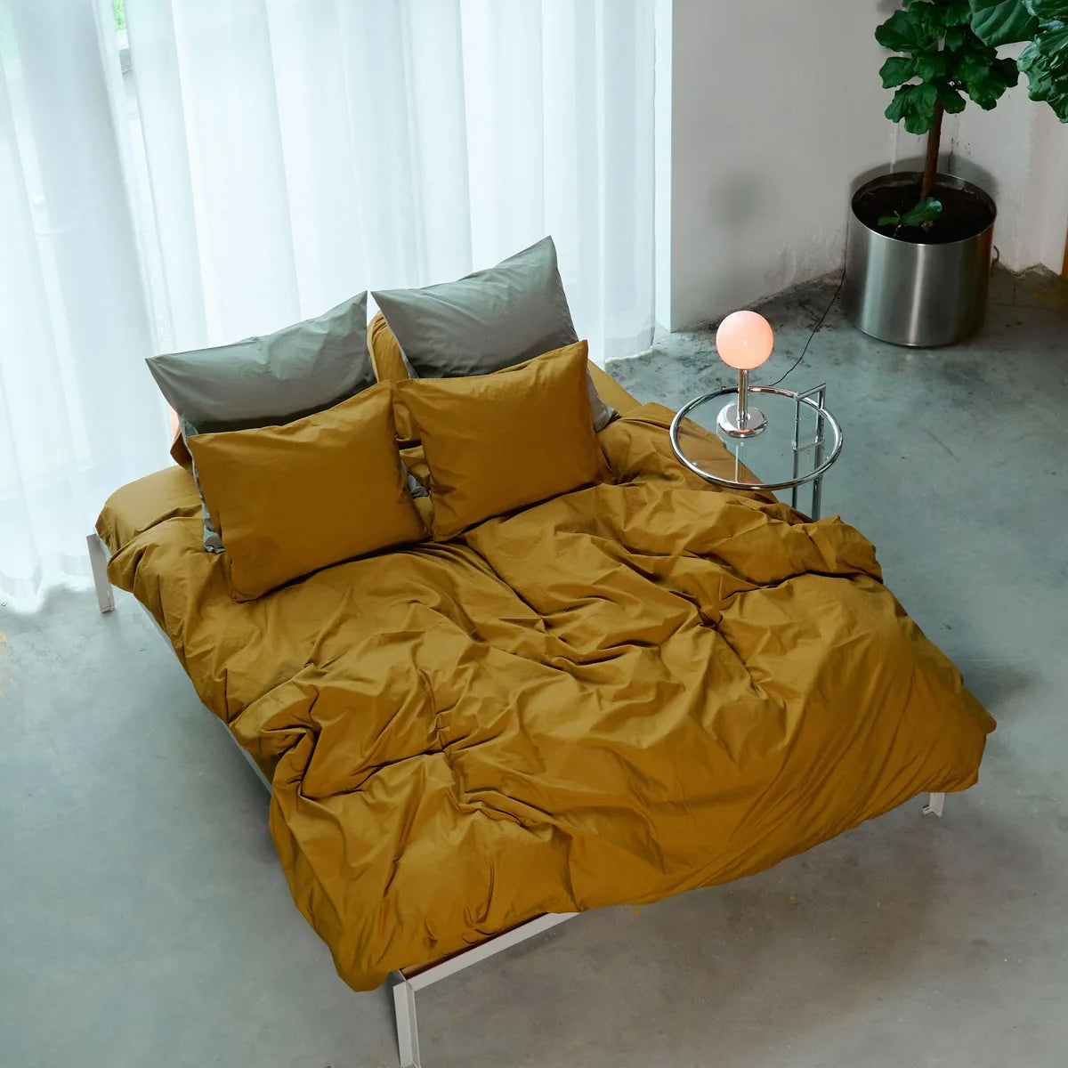 GoHuug bedspread cover on a bed in a bright bedroom